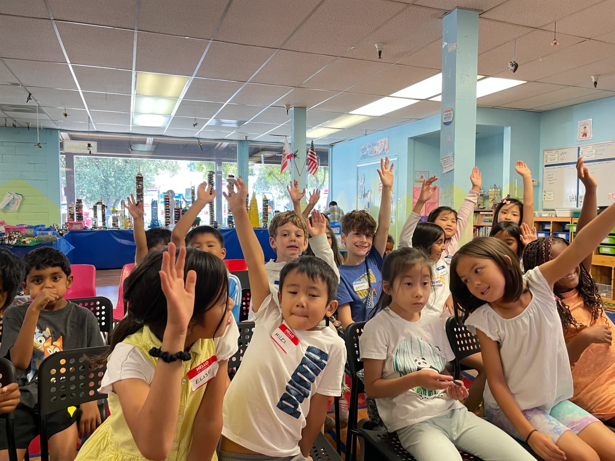Children collaborating on a LEGO city build at Kidizens